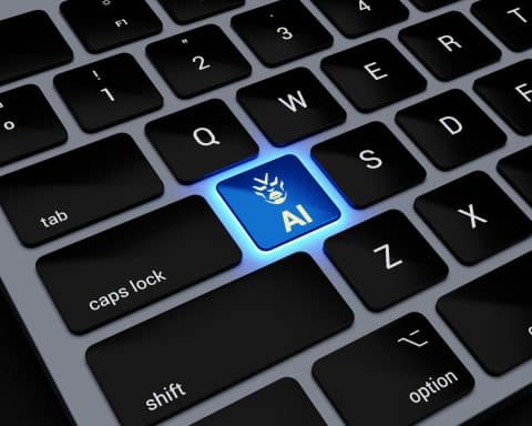 Close up of a Mac keyboard, one key, labelled AI, glowing obviously.
